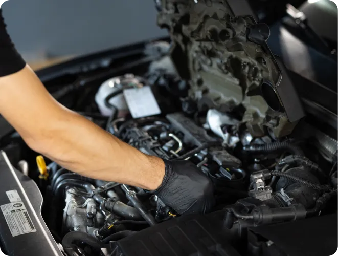 Person working on car engine