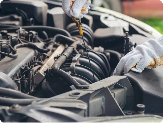 Checking engine oil level with dipstick