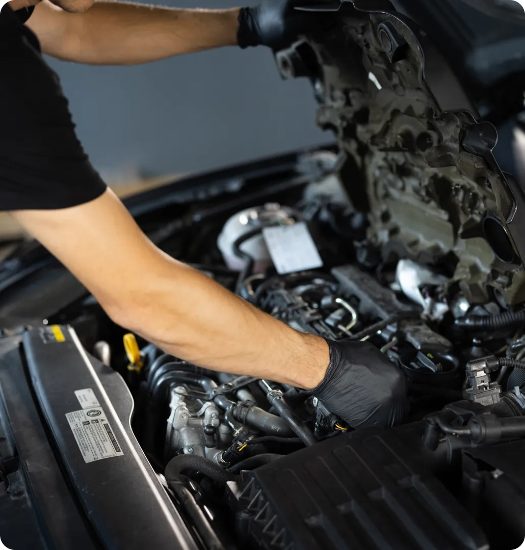 Person working on car engine